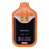 Boutiq Switch V4 2G dual-chamber vape pen displaying Lime-Z and Kiwi cannabis oil, with digital screen and 'SWITCH' button, on a clean white background.